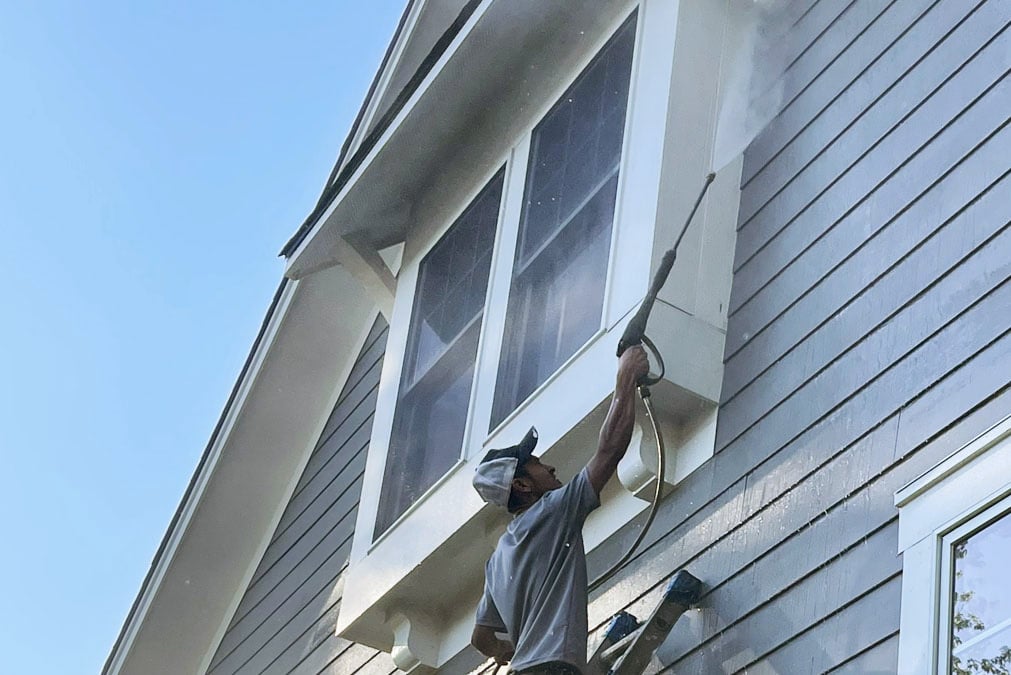 Sean Hadden Painting employee performing residential power washing services in Carmel, IN.